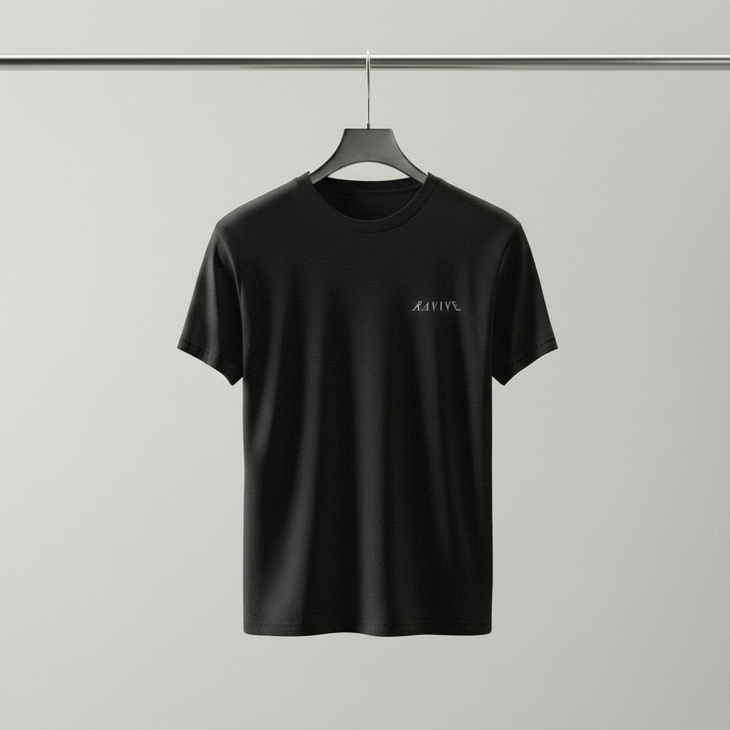 Black oversized organic cotton t-shirt with small white RAVIVE reverb logo on left chest, hanging on black hanger against a white background.