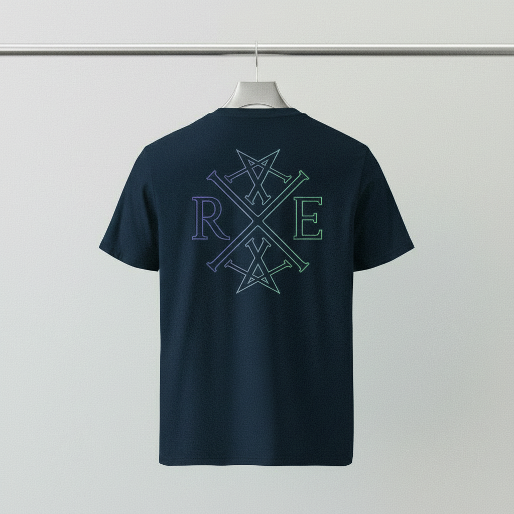 Navy oversized organic cotton T-shirt with large RAVIVE monogram logo printed in light blue and green on the back, shown on a hanger.