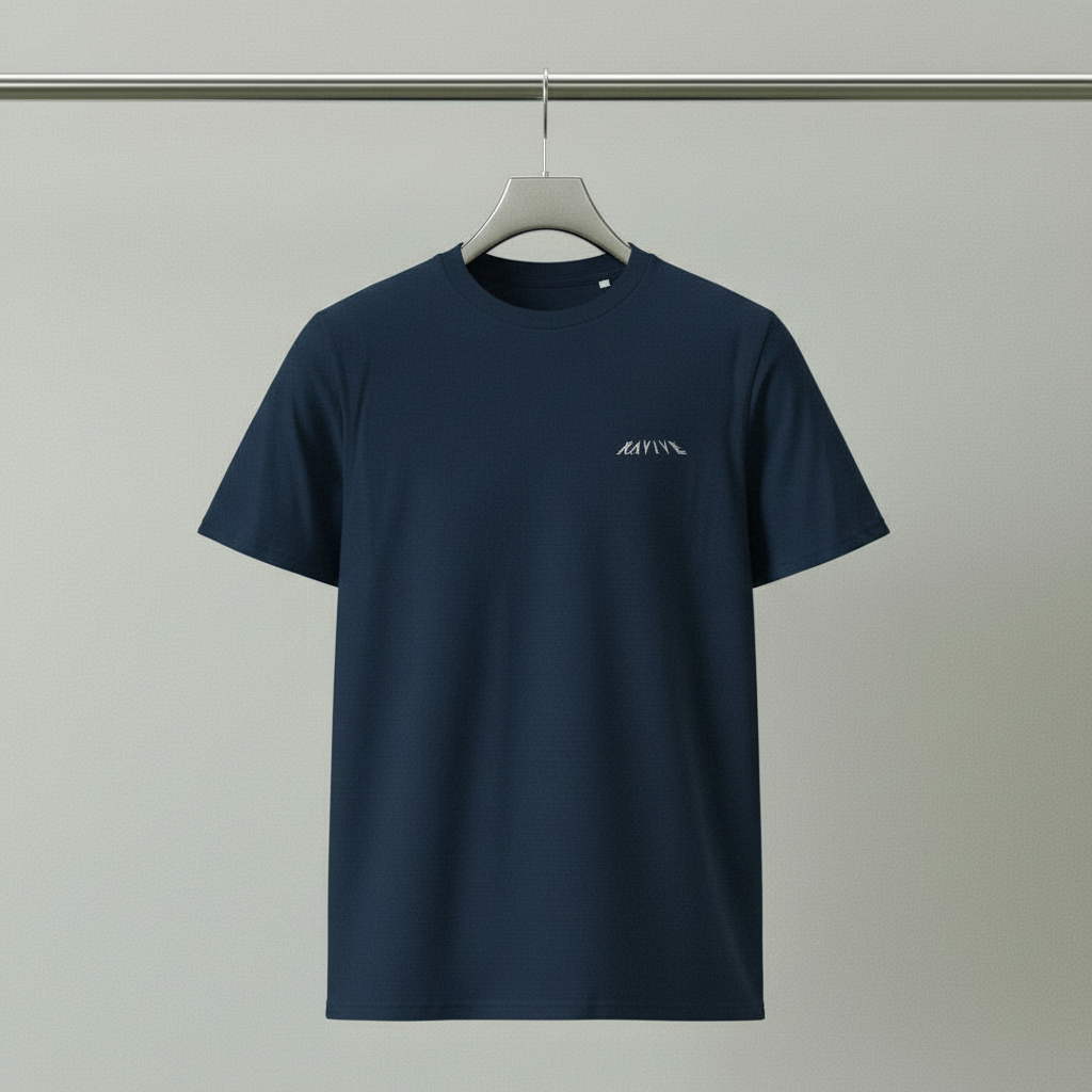 Navy oversized organic cotton t-shirt with white RAVIVE monogram logo on left chest, hanging on a minimalist hanger.