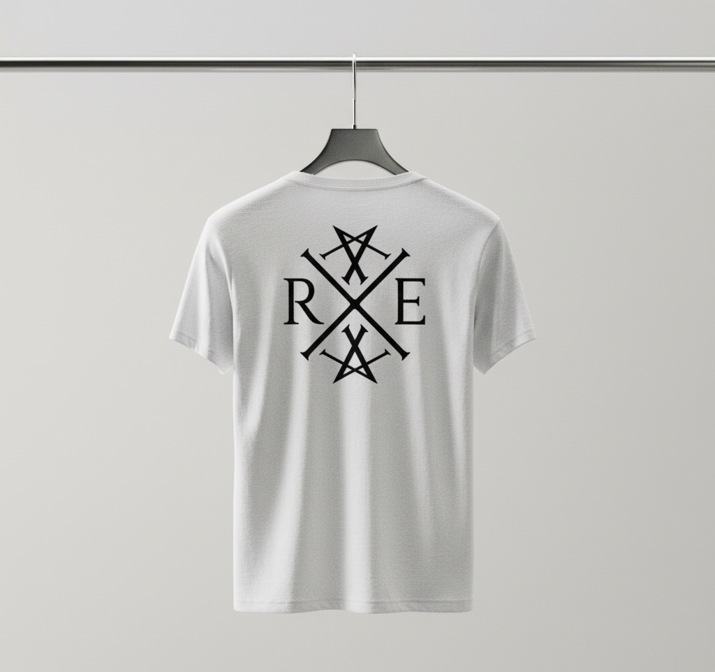 White oversized organic cotton T-shirt hanging on a black hanger against a plain grey background, featuring a large black RAVIVE monogram on the back.