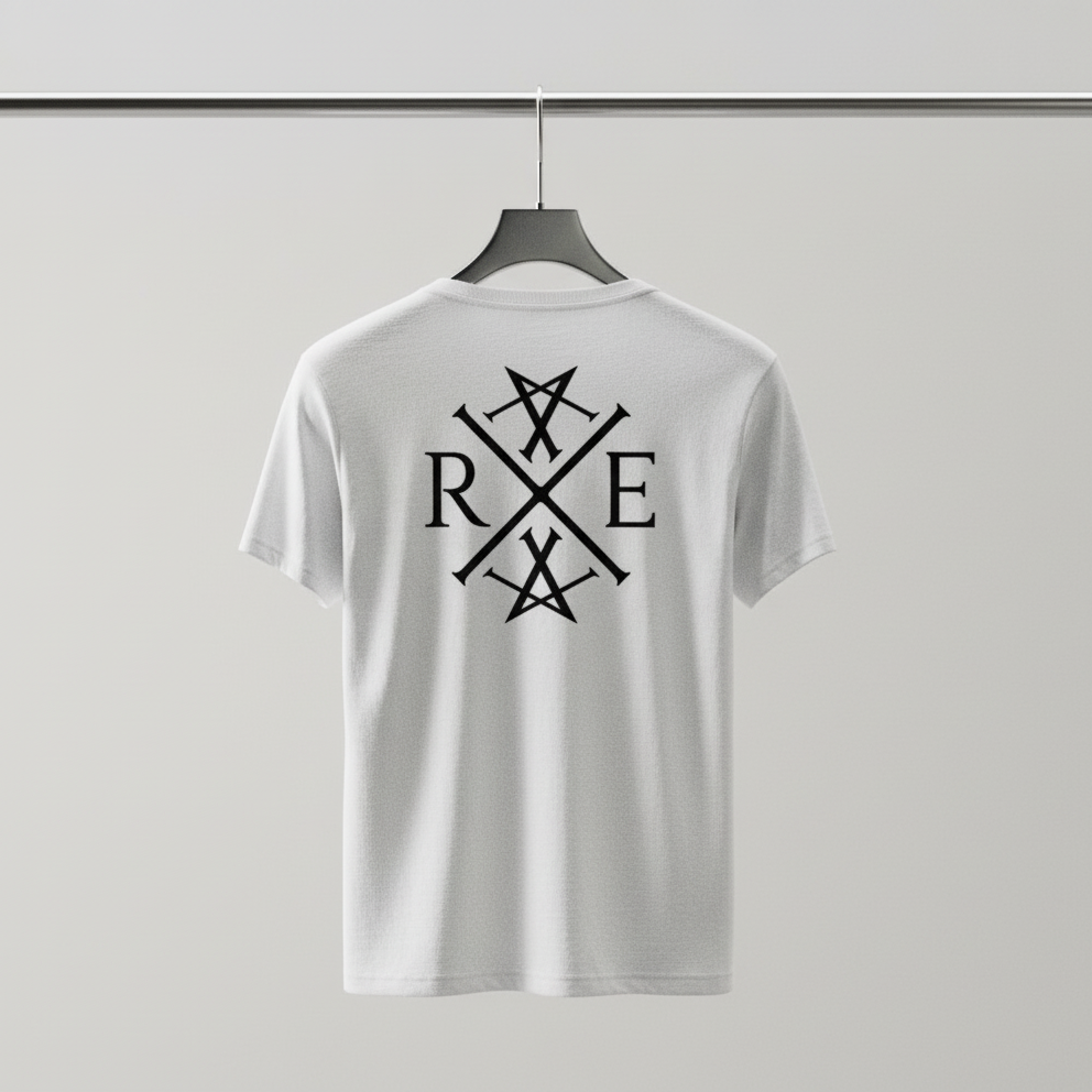 White oversized organic cotton T-shirt hanging on a black hanger against a plain grey background, featuring a large black RAVIVE monogram on the back.