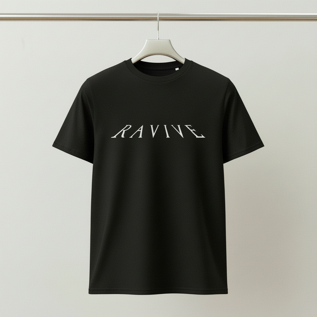 Black oversized organic cotton t-shirt with white RAVIVE reverb logo centered on front, displayed on a hanger against a grey background.