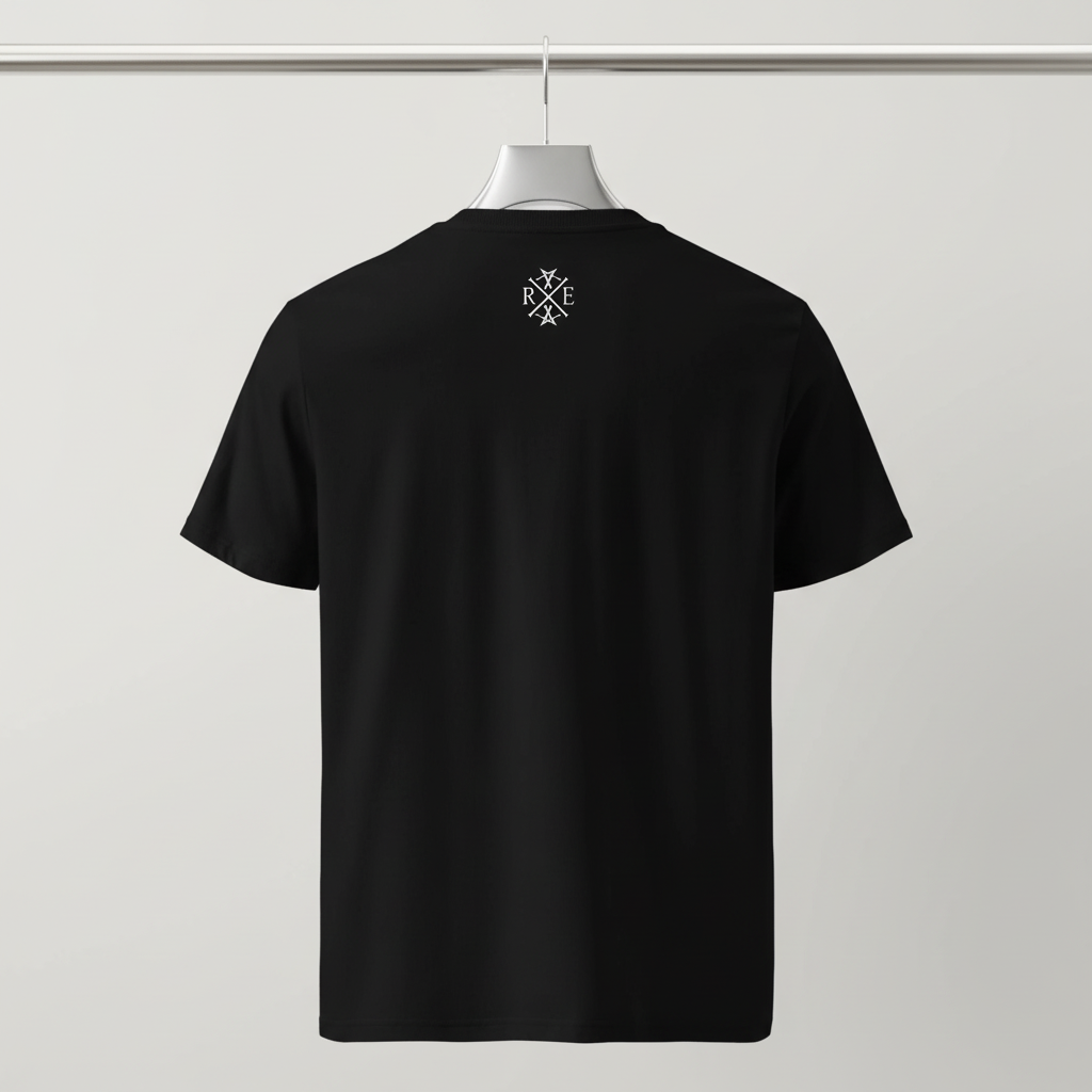 Black oversized organic cotton t-shirt with small white RAVIVE monogram logo on upper back, hanging on white hanger against a grey background.
